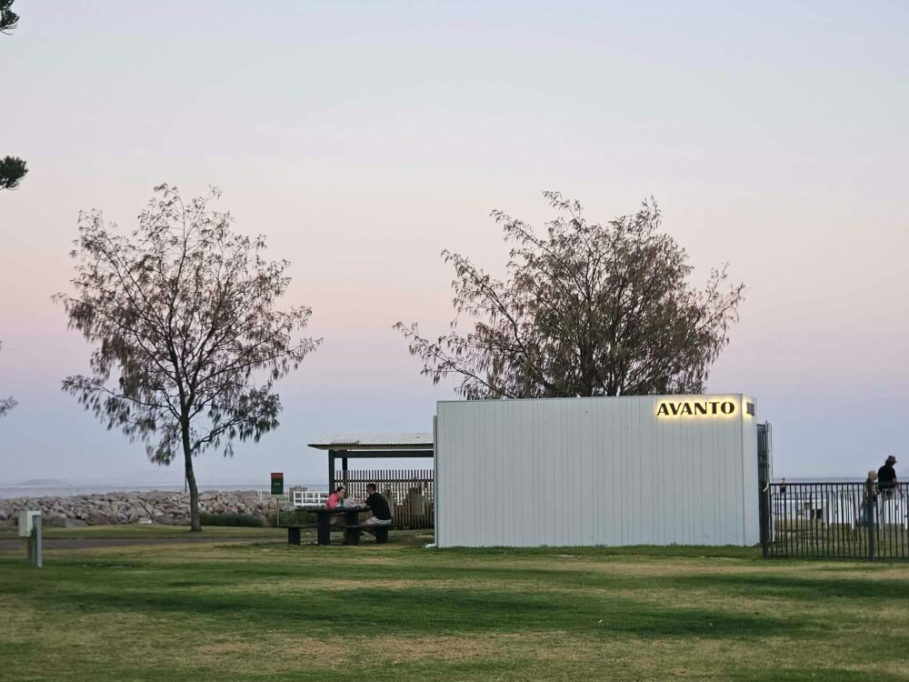 Avanto Sauna on Esperance foreshore at dusk, white sauna, coastal trees, ocean backdrop