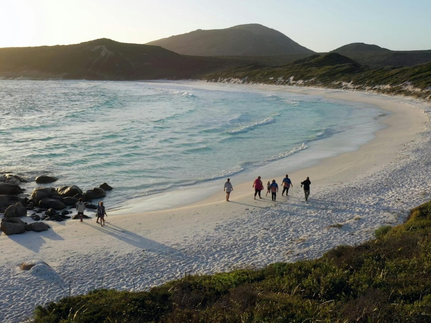 Guests walking along the white sandy beaches of Mandawoornup