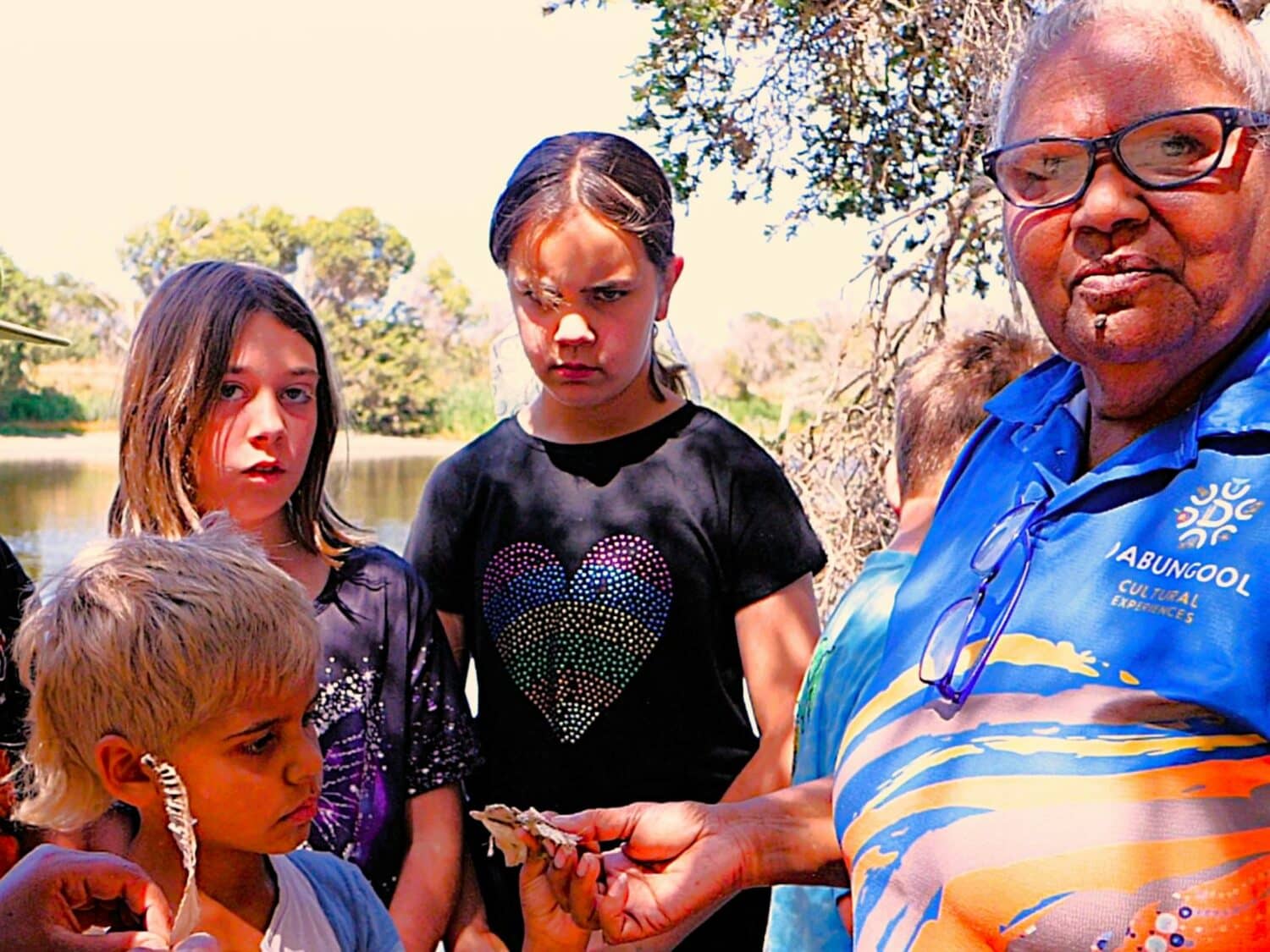 Annie showing the Children some bushtucker