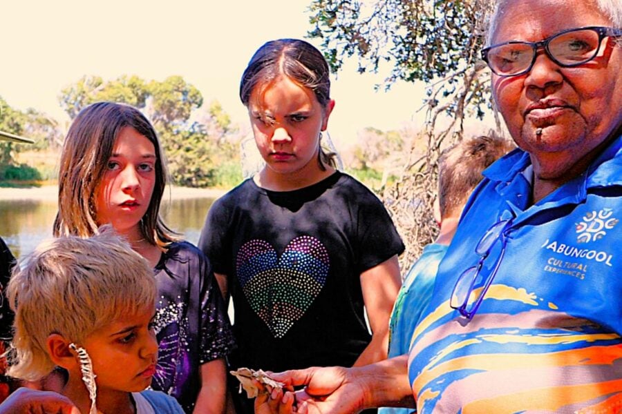Annie showing the Children some bushtucker