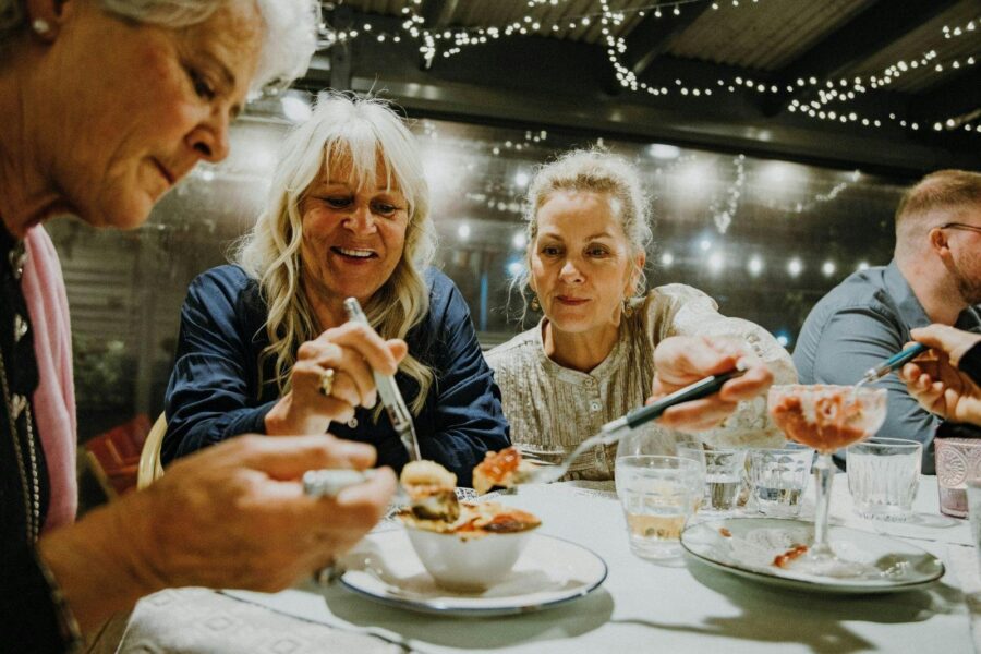 Three guests share a creme brulee